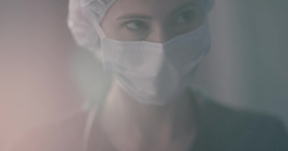 Unconscious man getting treated by female doctor