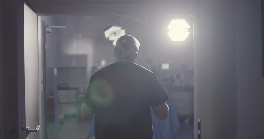 Surgeon walking into operating room to start a surgery