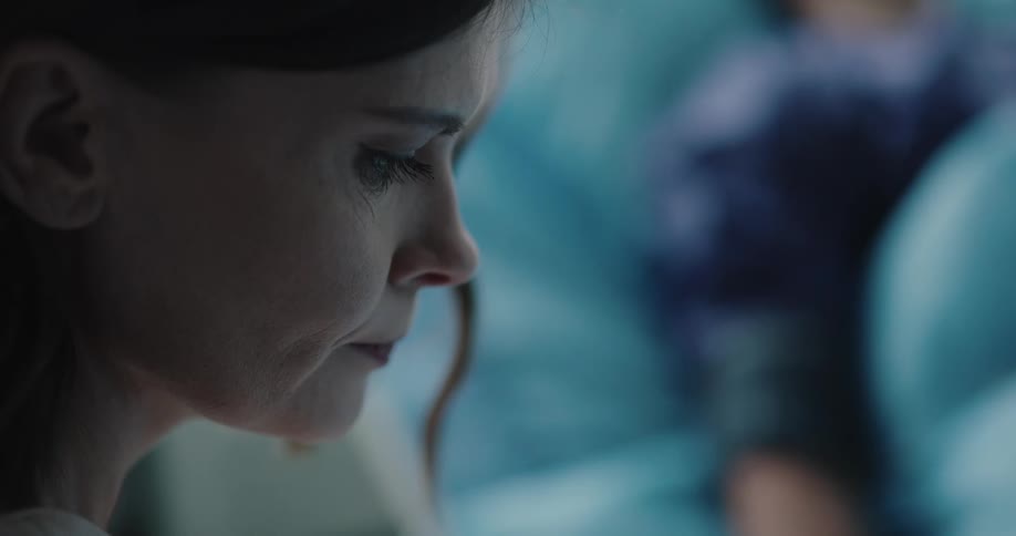 A sad woman on the hospital room near her husband