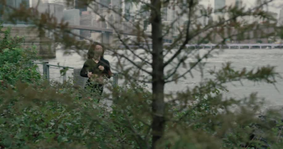 Young woman running at the public park