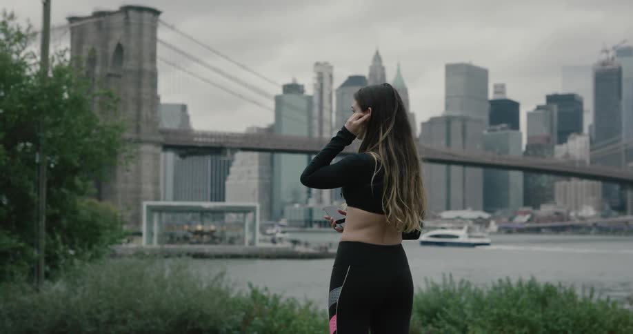 A woman is outdoors looking at the skyline