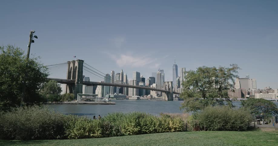 A bridge over a river in a large metropolis