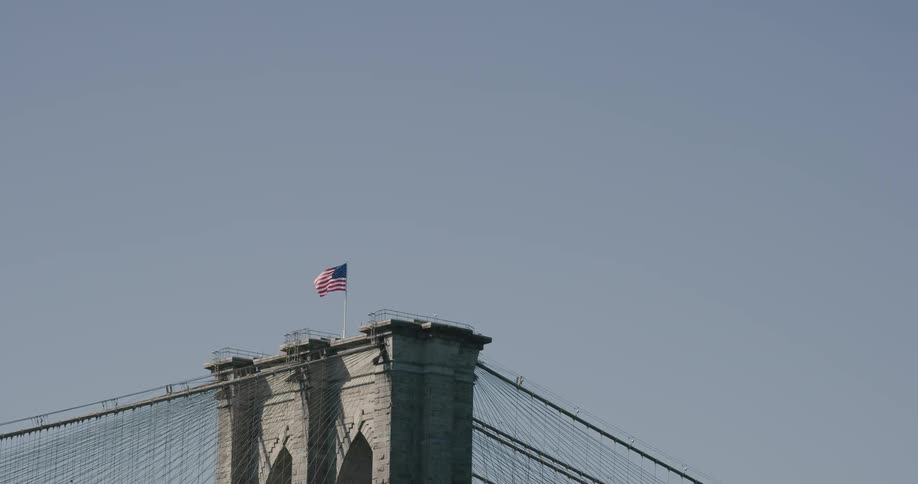 A flag is on top of a statue