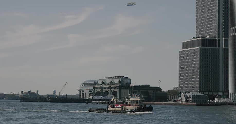 Boat sailing at the sea with tower background