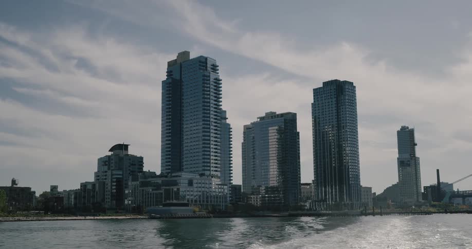 An aerial view of a skyline is shown by a ocean