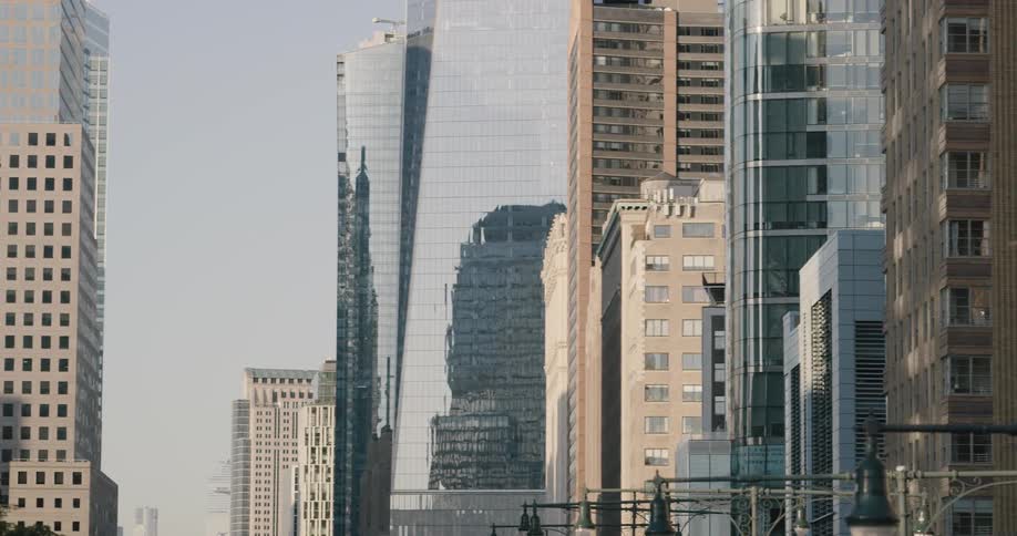 Skyscrapers made out of different materials fill a city skyline