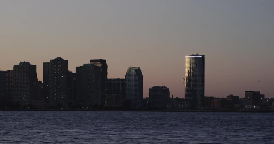 A scenery of a city skyline at dawn