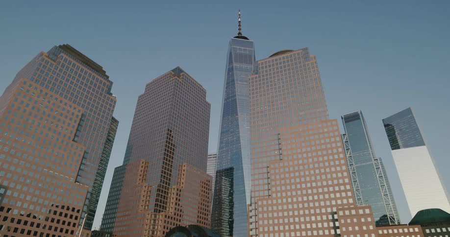 Tall skyscrapers hover above a body of water