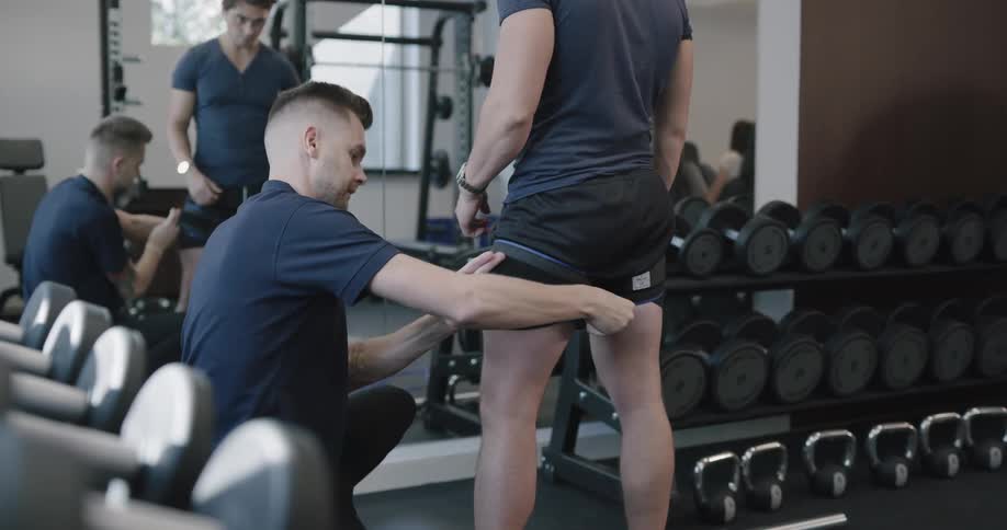 People are in a gym working out