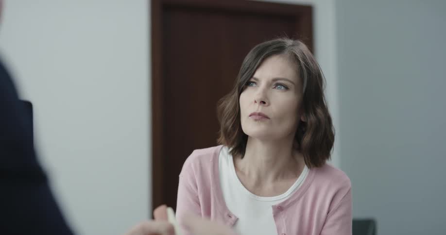 A woman is in a room with a doctor