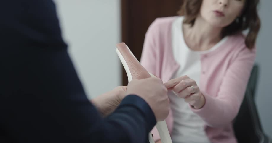 Doctor explaining about joint to the patient
