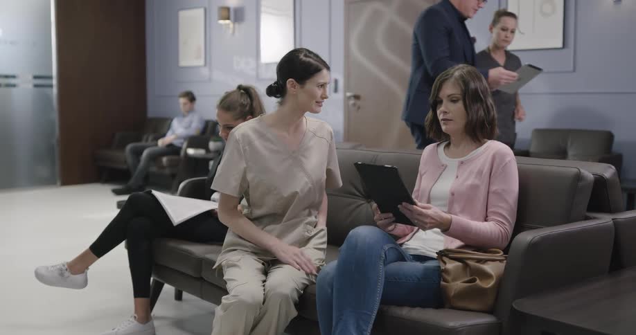 People are in a waiting room at a doctor office