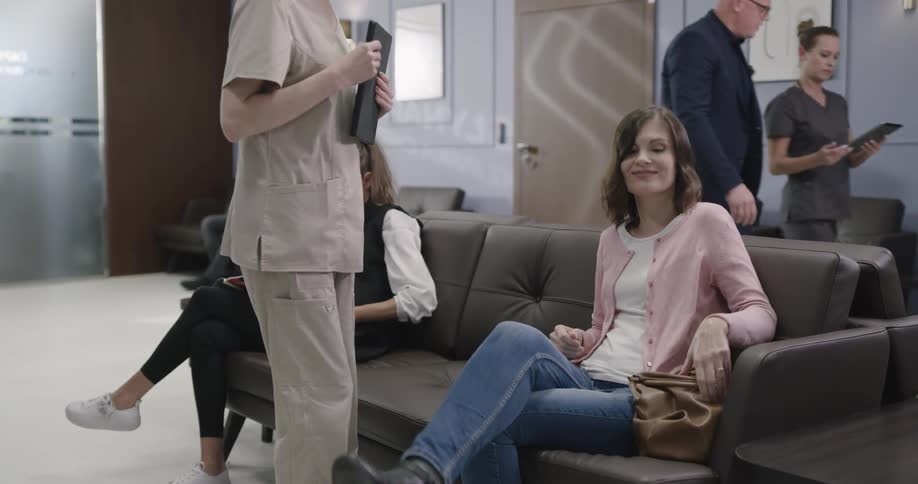 People are in a waiting room at a doctors office
