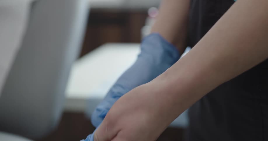 A doctor wearing a latex gloves for a surgeon