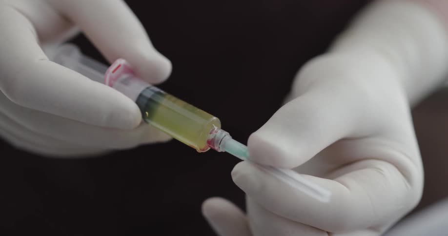 Doctor doing an injection to a patient