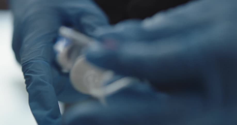 A tube of medicine is getting set up