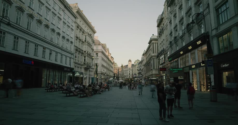 Crowd walk along plaza between buildings