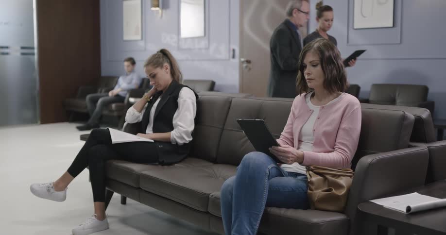 People are sitting in a waiting room together