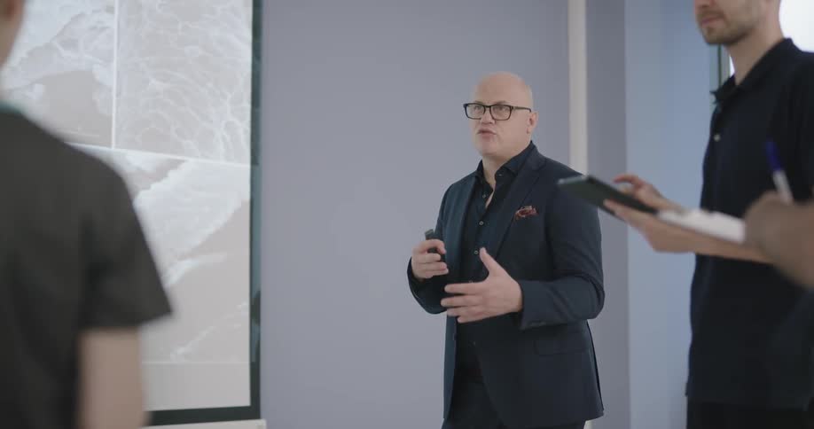 Man explain something on the projector to the audience