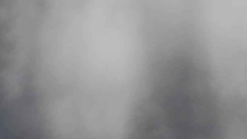 Fog is rising in a dark room