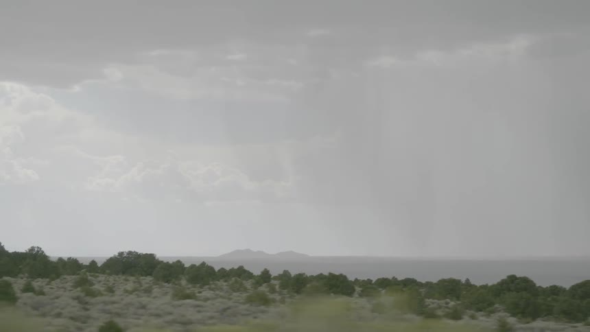 Landscape view of grasslands with hills in the back