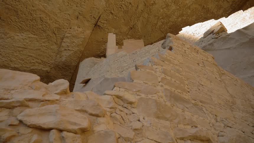 A close up view of an ancient looking man made cave