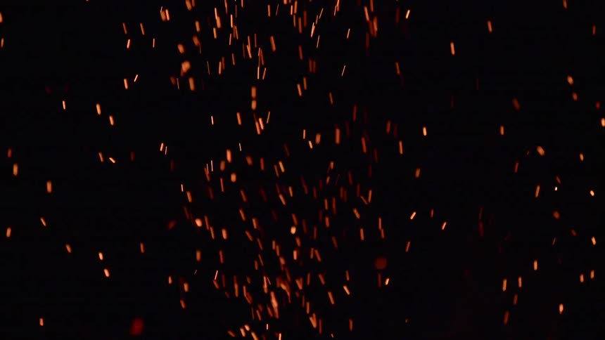 Sparks from a fire shoot into the sky