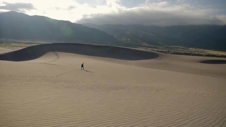 A person walks in the desert