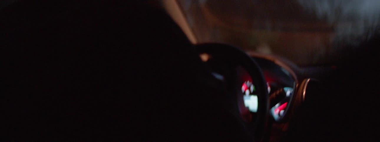 A person is driving in a car