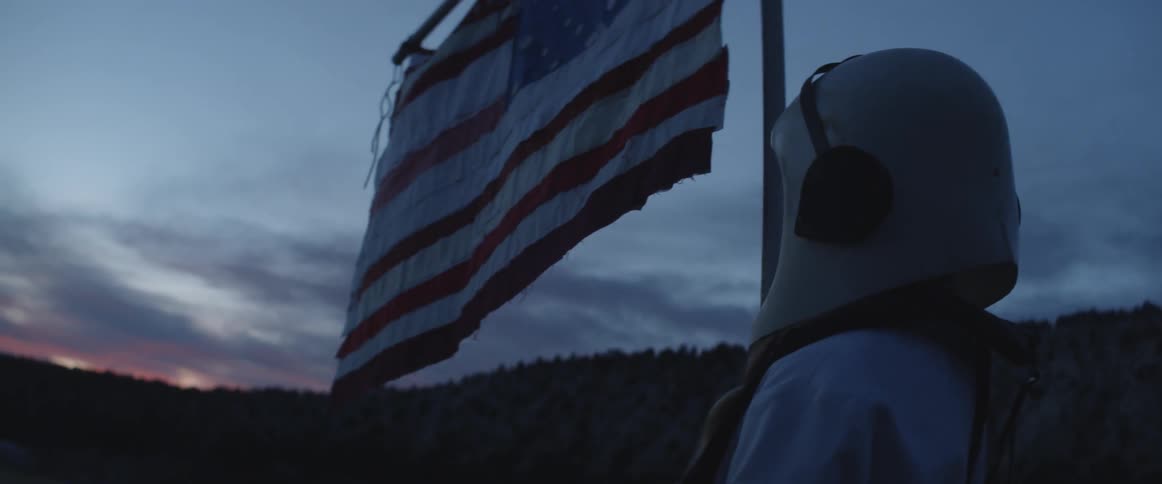 Girl with astronaut suit and american flag