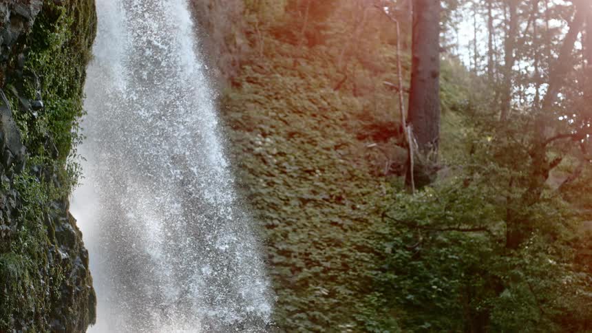 A slow motion of a waterfall in the forest