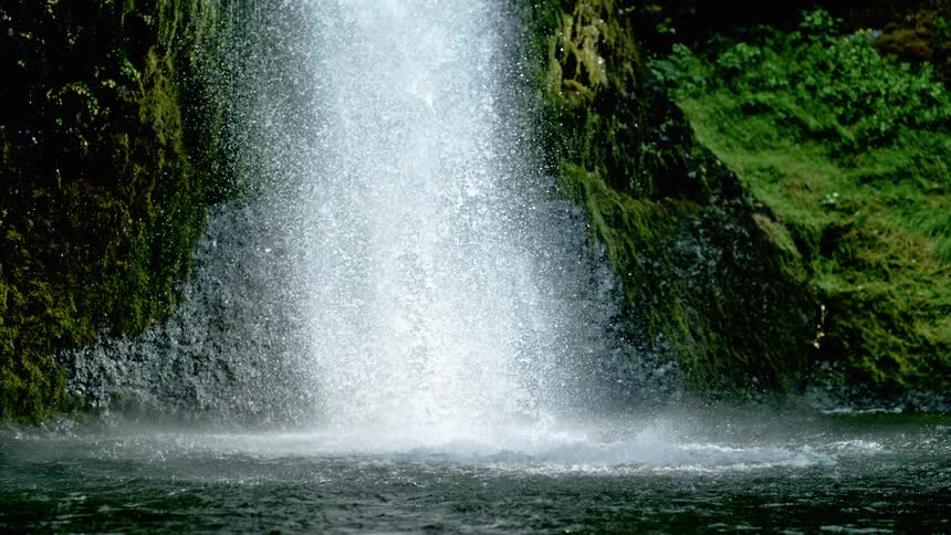 A waterfall crashing down the side of a hill