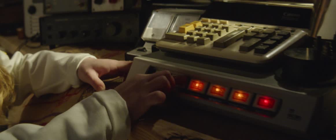 A girl turning on a time machine