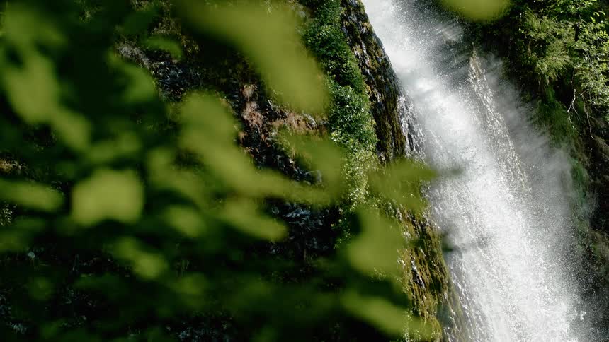 A slow motion of a waterfall in the wild