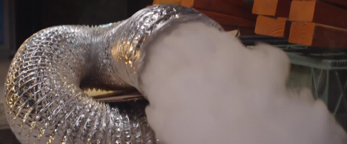 Steam pours out of a tube