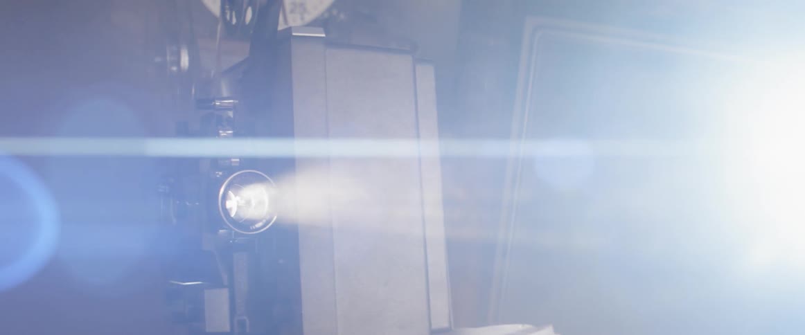 A projector projecting film to the screen