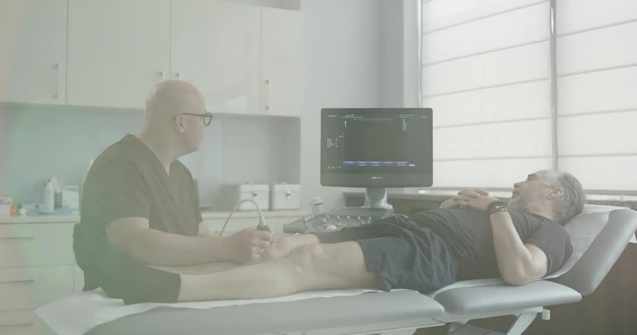 A bald doctor checking male patient condition