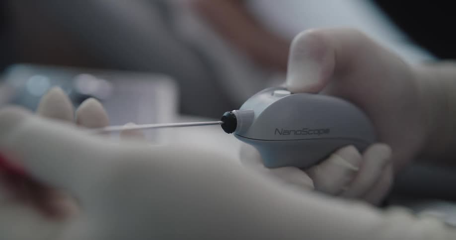 A doctor checking his nanoscope devices