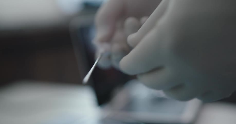 Doctor preparing a tools for a surgeon