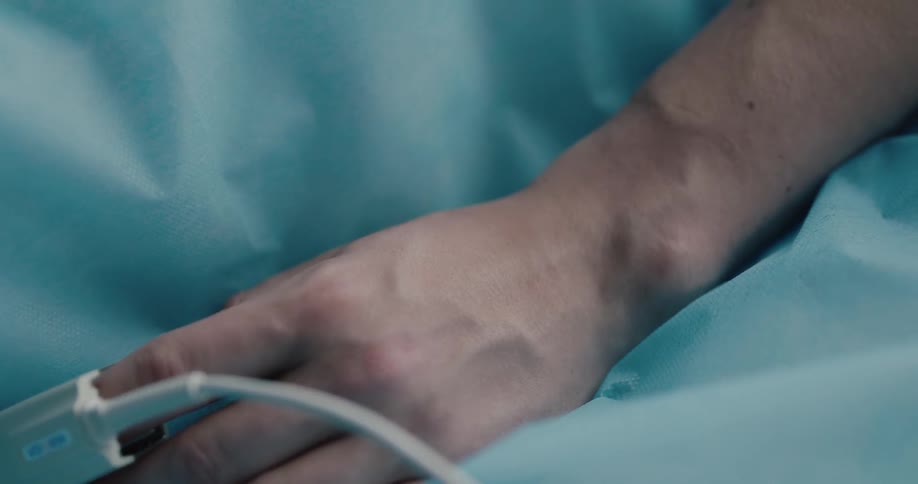 A sensor is clamped to a patients finger