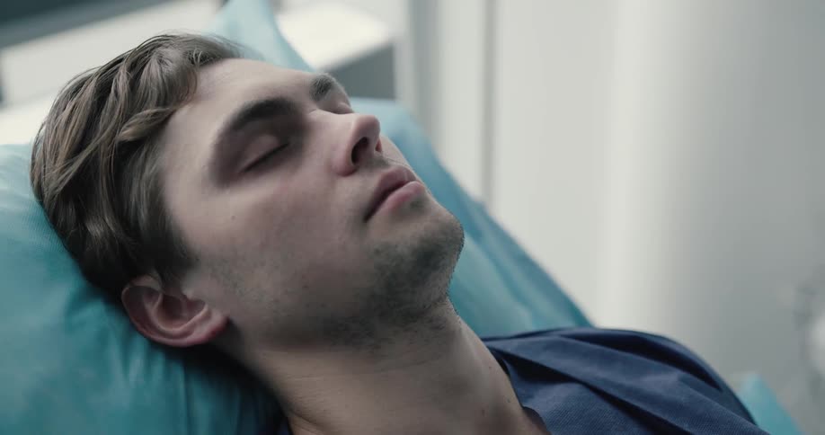 Patient lays on inclined bed