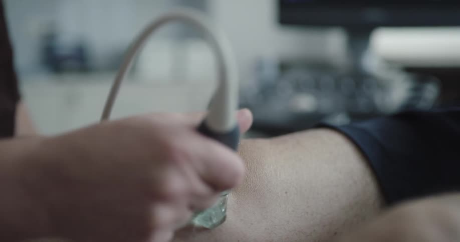 A doctor is doing a procedure on a patient