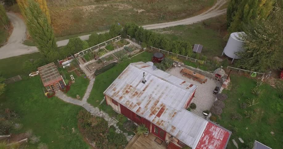 A rising aerial view of a farm