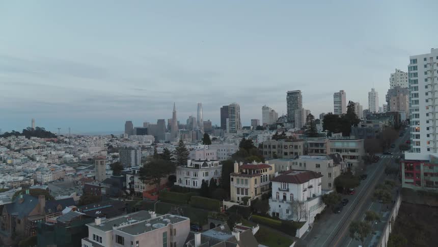 A densely populated urban neighborhood sits atop one of many hillsides within the city of san francisco