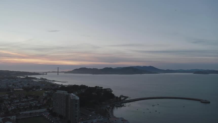 Skyline view of the city and water with hills in the far distance