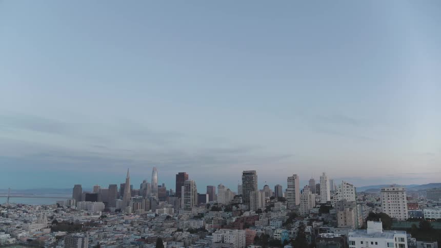 A city with buildings and skyscrapers with the sky in the background