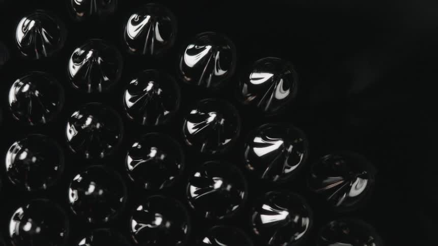 A dark ferromagnetic liquid suddenly produces an array of droplets at the surface that then dissipate back into the surrounding fluid
