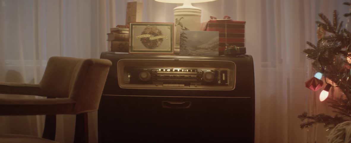 Vintage jukebox near a christmas tree indoors in a family home