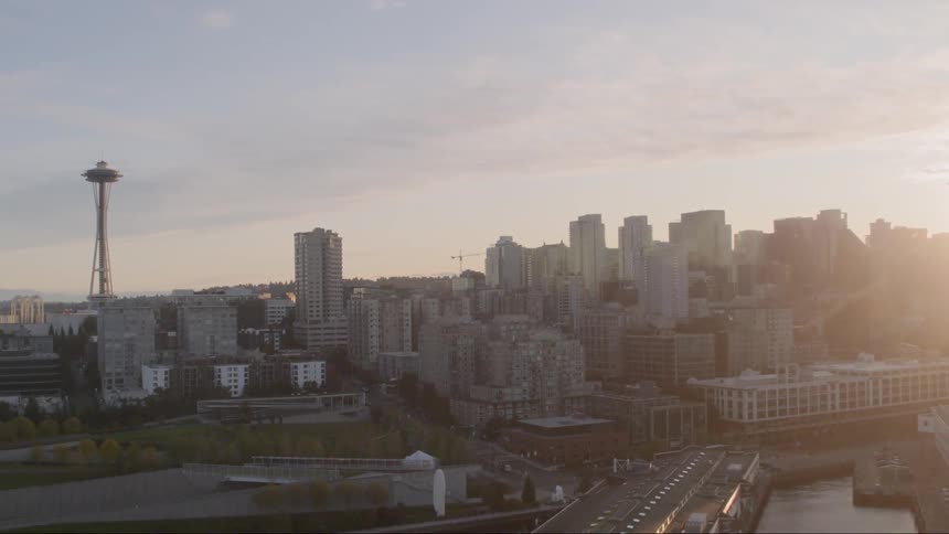 An view of downtown seattle at dusk with the space needle prominently in sight