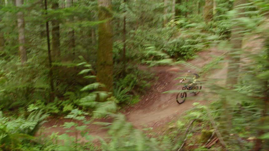 A person is riding a dirt bike outdoors